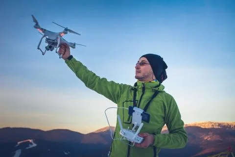 Man operating a drone Stock Photos