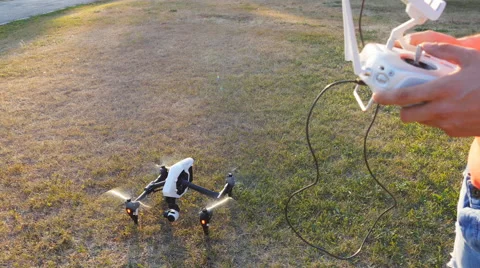 Man operating a drone with remote control Stock Footage 65886339