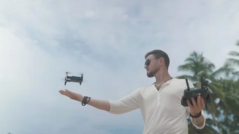 Man operating a drone with remote control Stock Footage 109421758