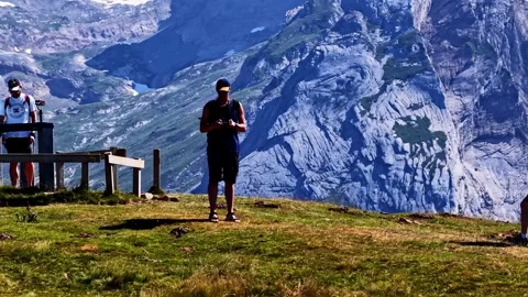 Man operating a drone with a remote control from a viewpoint in the French Stock-Footage 345504685