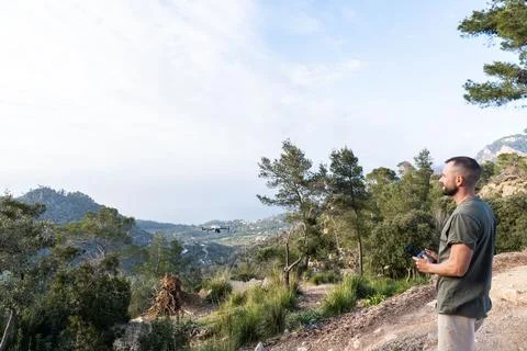 Man operating the drone by remote control and having fun Stock Photos