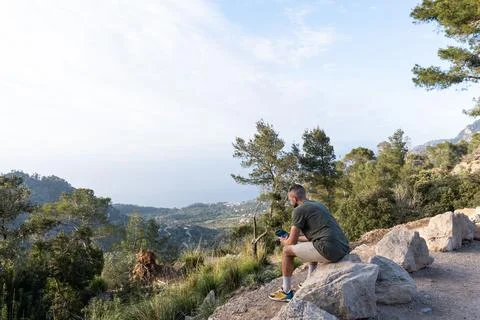 Man operating the drone by remote control screen and having fun Stock Photos