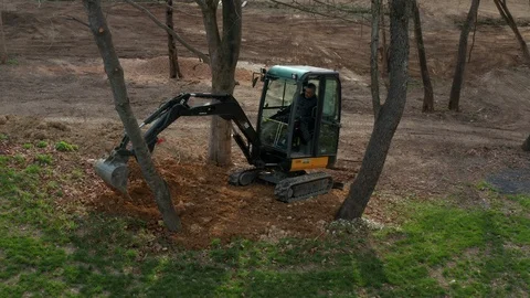 Man Operating an Excavator to Work Stock Footage 106258011