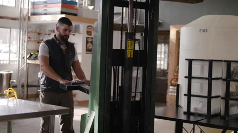 A man operating a forklift Stock Footage 137675336