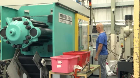 Man operating injection moulding machine Stock Footage 46632455