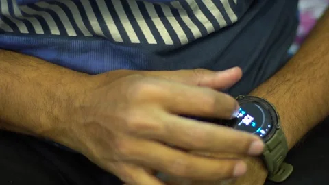 A man operating its smart watch with right hand Stock Footage 272754431