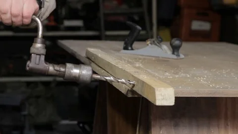 Man operating old hand drill Stock Footage 73170654