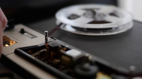 Man operating an old tape recorder Stock Footage 107322377