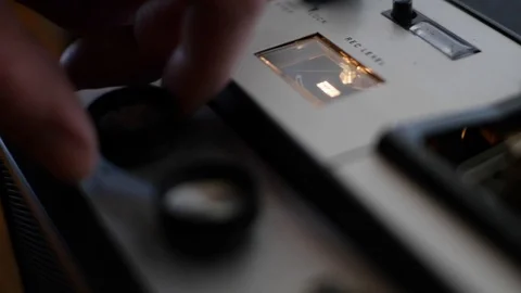 Man operating an old tape recorder Stock Footage 107322383