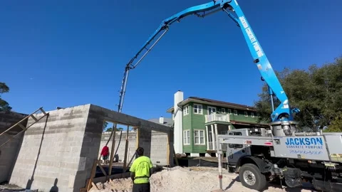 Man operating remote control for concrete pump truck Video stock 233039294