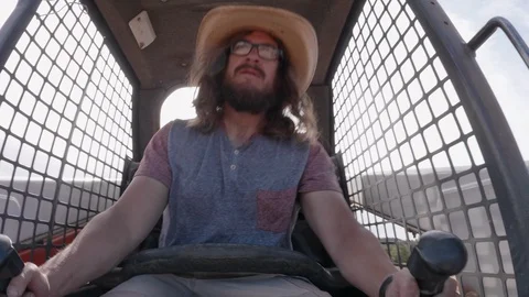 Man Operating Skid Steer Video stock 128524837