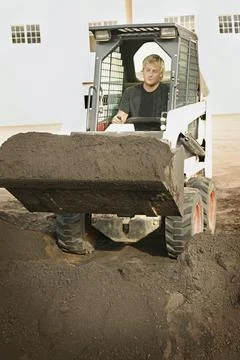 Man Operating Small Digger Stock Photos