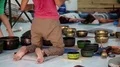 Man operating with Tibetan singing bowls HD Footage