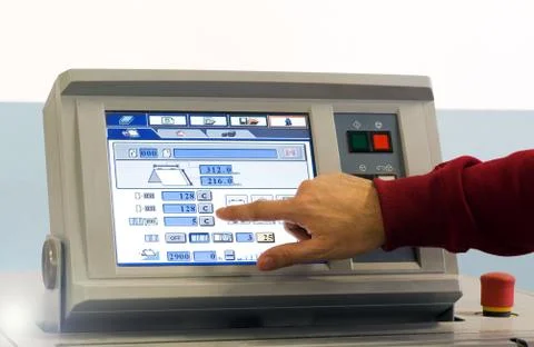 Man Operating Touch Screen Device at the Table Foto stock