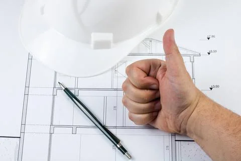 Man like or approve the architectural plan with showing like gesture with han Stock Photos