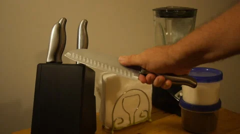 Man or criminal thief gets kitchen knife Stock Footage 56299538