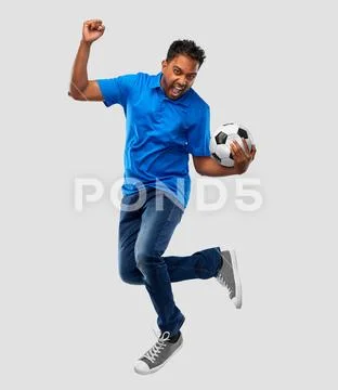 Man or football fan with soccer ball jumping Stock Photos