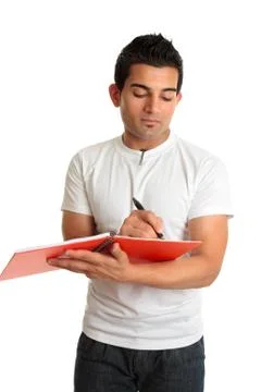 Man or student writing in a notebook Stock Photos