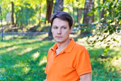Man in orange clothes Stock Photos