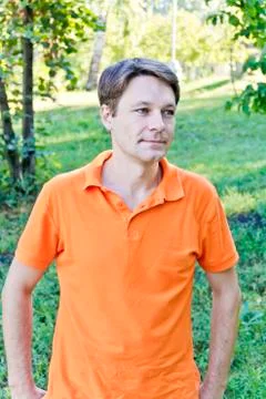 Man in orange clothes Stock Photos