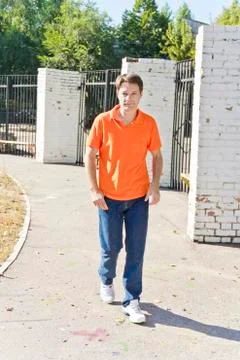 Man in orange clothes Stock Photos