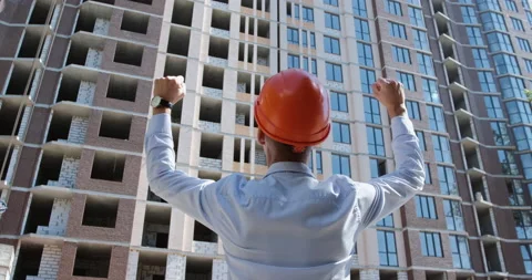 A man in an orange protective helmet 動画素材 144912118