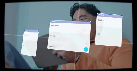 Man in orange top tapping tablet in blue-gray room, viewing three UI panels, Stock Photos