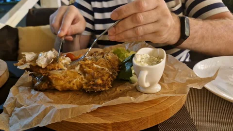 The man ordered fish in a restaurant. fish baked in the oven Stock Footage 247435293