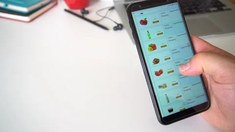 Man Orders Food or Vegetable Office In An Online Store Using A Smartphone. Vidéo 145676933