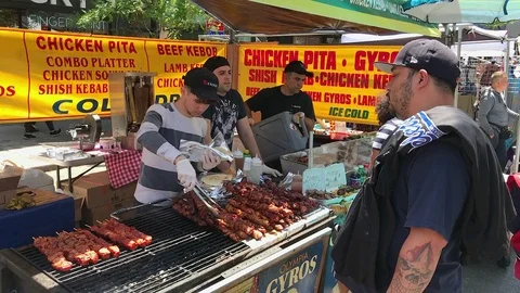 Man Orders Greek Beef Kebab Wrapped in Pita Bread Stock Footage 76134439