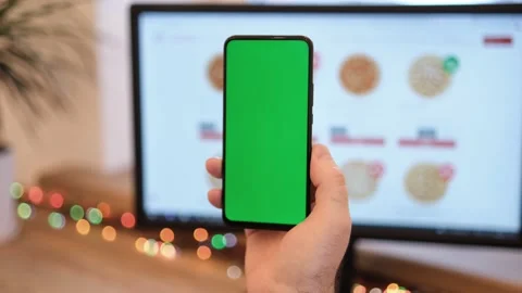 A man orders pizza. Pizza. A man in her office is holding a smartphone with a Stock Footage 170527602