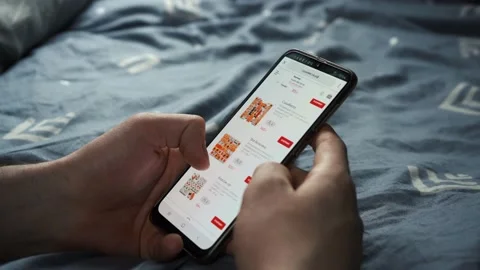 Man orders sushi through the phone. Moscow, Russia. May 12, 2021. Stock Footage 154136102