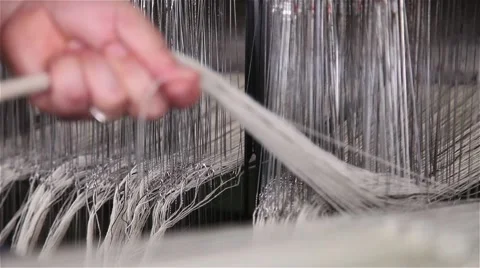 Man organize lines in loom Stock Footage 56525927