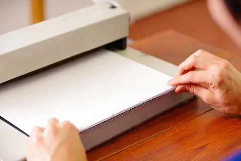 Man organizing the documents using his hands to binding documents using a Stock Photos