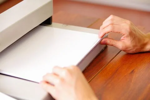 Man organizing the documents using his hands to binding documents using a Stock Photos