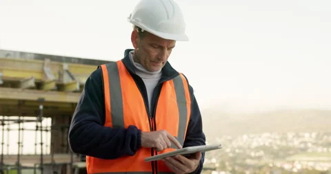 Man, outdoor and construction worker on site with tablet for update on Stock Footage 343363702
