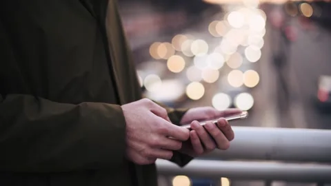Man outdoor with smartphone chatting. Stock Footage 171709562
