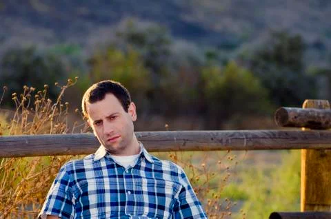 Man outdoors with indifferent expression Stock Photos