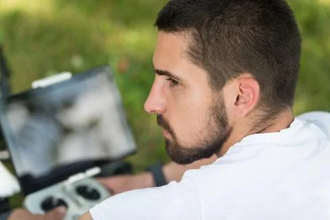 Man Outdoors With Remote Control Preparing the Drone Stock Photos