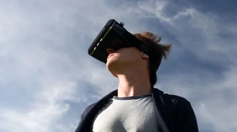 Man outside using Virtual Reality headset Stock Footage 68707251
