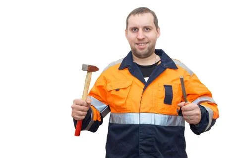 Man in overalls with a hammer and chisel Stock Photos