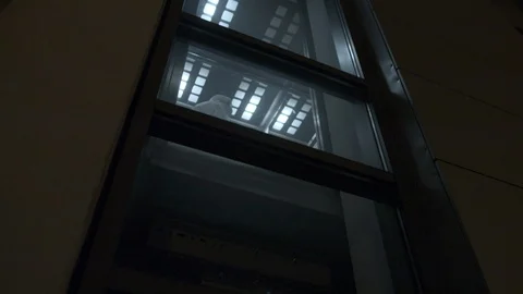 The man in overalls rides the elevator, coronavirus pandemic Stock Footage 126910061