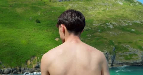 Man Overlooking Coastal Landscape: Видео 343669375