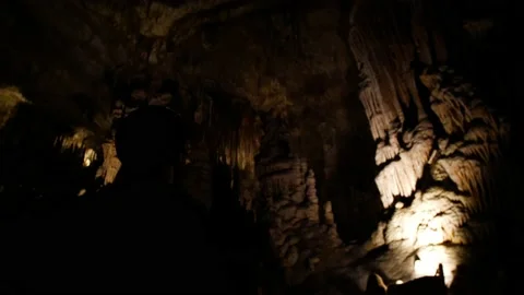 Man overlooking inside cave 4K 2 Stock Footage 139982165
