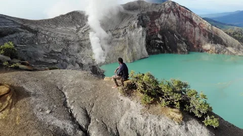 Man Overlooking Java Indonesia Sulfur Volcano Kawah Ijen Stock Footage 142341012