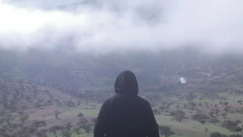 Man Overlooking Misty Terraced Valley, Ait Issafen, Morocco Stock Footage 332772628