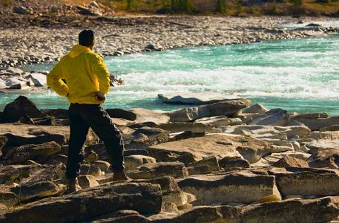 Man Overlooking A Mountain River 스톡 사진