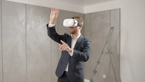 Man owner has put on vr technology and estimates the apartment already furnished Video stock 244227766