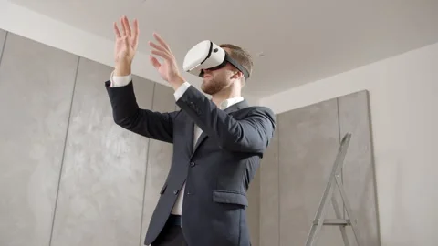 Man owner has put on vr technology and estimates the apartment already furnished Video stock 251739191