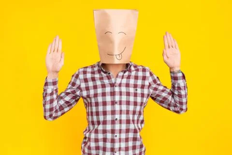 Man with package on head, hands up, drawn funny face Stock Photos